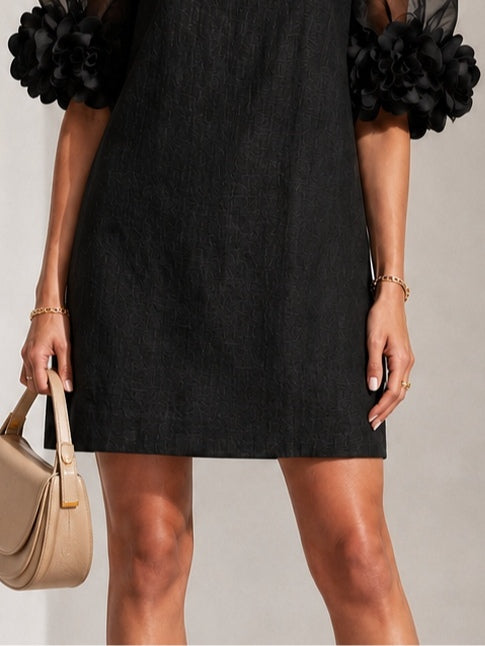 Fabienne - Robe courte en organza noir à manches bouffantes et poignets fleuris spectaculaires