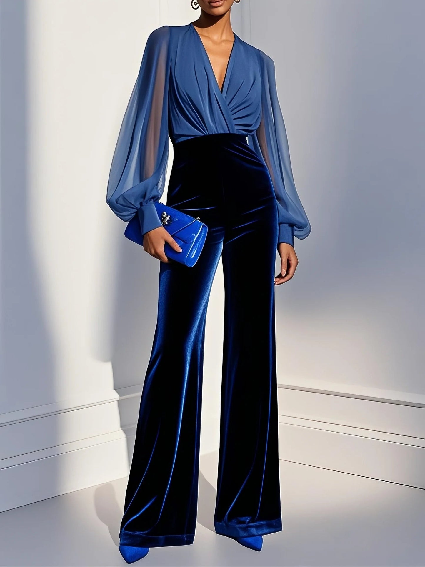 Jumpsuit en velours bleu à manches longues et décolleté en V